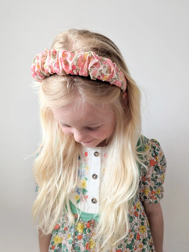 girl with long blonde hair wearing her beautiful hairband headband